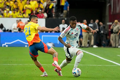 Daniel Munoz and Josimar Alcocer battle for the ball
